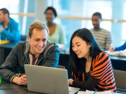 Adult Education students collaborating on computer