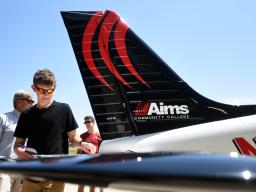 People looking at Aims Airplanes