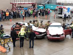 Safety personnel standing around two vehicles