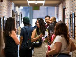 People looking at artwork at the Aims Art Show