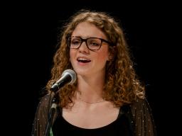 student singing at Ed Beaty Hall Theater
