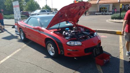 Red car with hood up