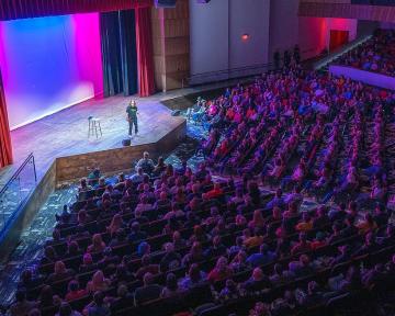 Comedian Josh Blue performs at the Aims Welcome Center