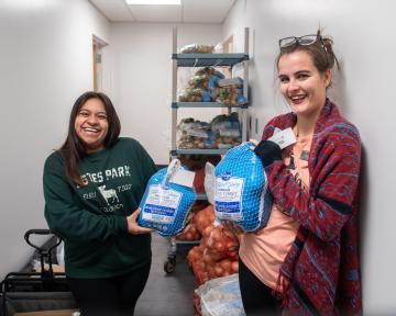 Students holding turkeys at Arty's Pantry