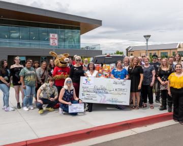 Group Photo with Check from Weld Community Credit Union