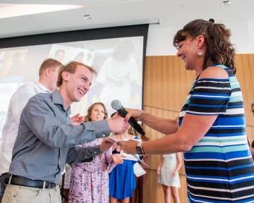 Student recieves pin at Med Prep pinning and celebration ceremony