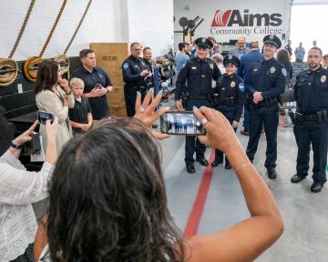 Families taking photos of Graduates at Police Academy Graduation