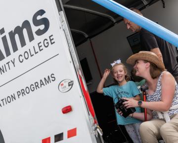 Adult and child in the mobile aviation lab