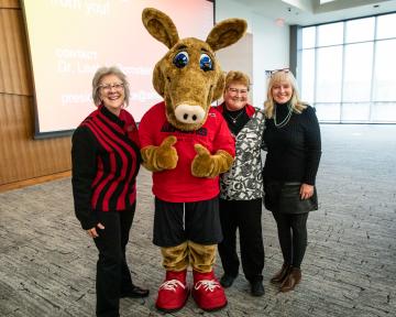 Aims leadership with Arty Mascot