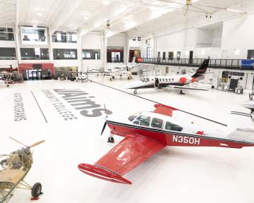 Aviation Maintenance Technician hangar with airplanes and aircraft