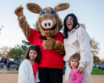 Mother and 2 young daughters with Arty Mascot at Aardvark Embark