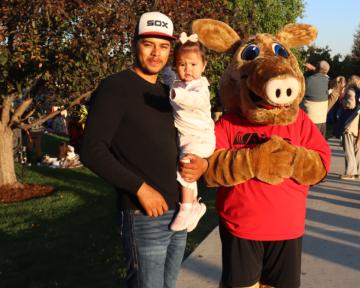 Father and child with Arty the Aardvark at Aims