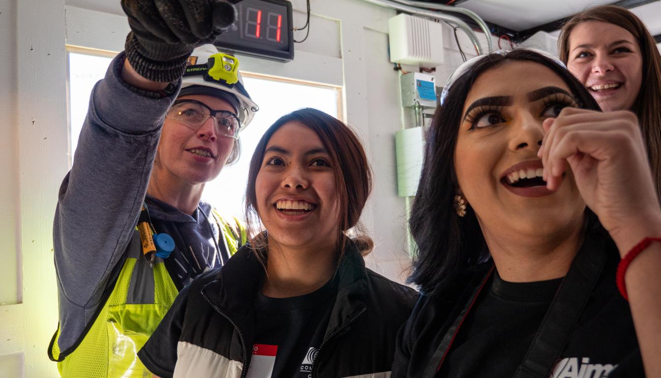 Students engaging at a Women in Construction event at Aims Community College