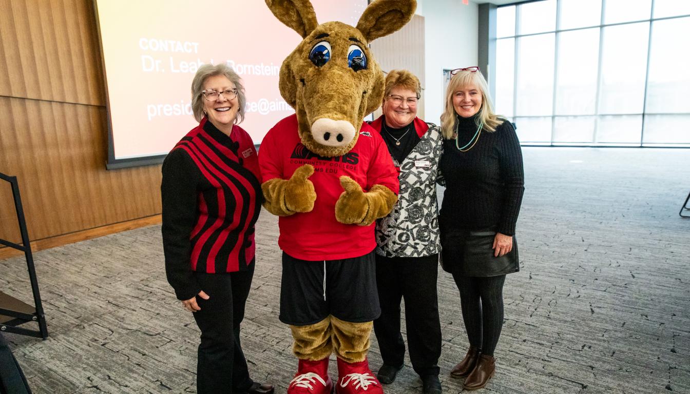 Pictured left to right: Dr. Leah L. Bornstein, Arty the Aardvark Mascot, Marilyn Schock and Heidi Windell.