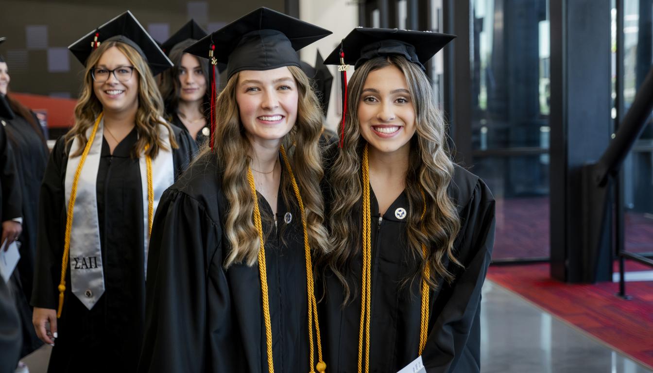 students in gaps and gowns