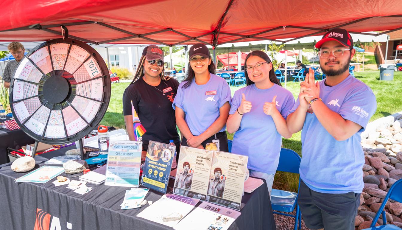 Aims staff at a booth during Fall In event