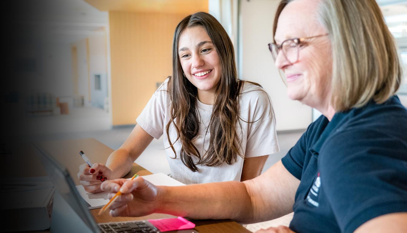Aims Student Working with an Aims Staff Member