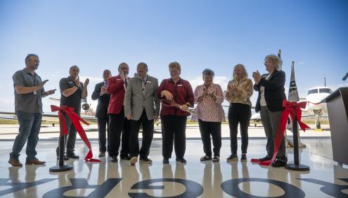 Aims AMTC Ribbon Cutting officials