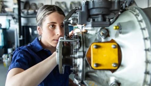 woman working on aircraft