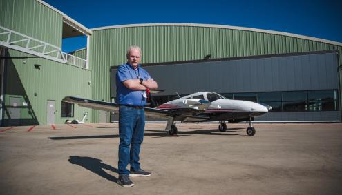 Bill Standerfer with airplane at Aims Flight Training Center