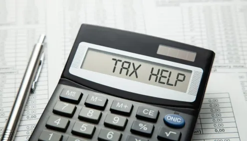 Calculator presenting the words Tax Help