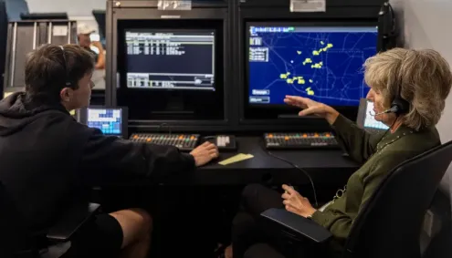 Patti Phillips with ATC Student at simulator