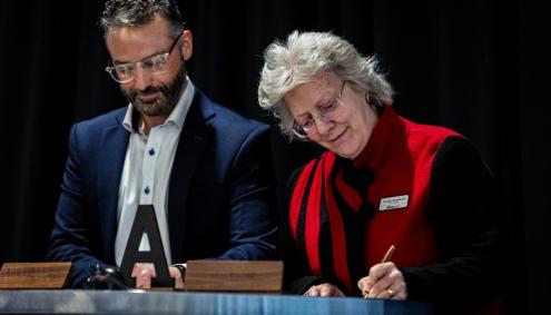 Zach from Alquist 3D and Dr. B sign an agreement