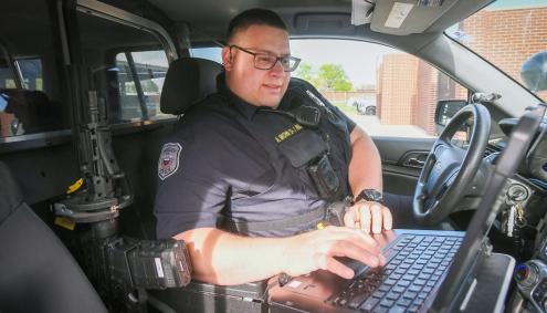 Andrew Brown in his Police Vehicle