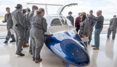 Aims students crowd around new jet