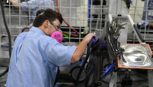 Student working on collision repair