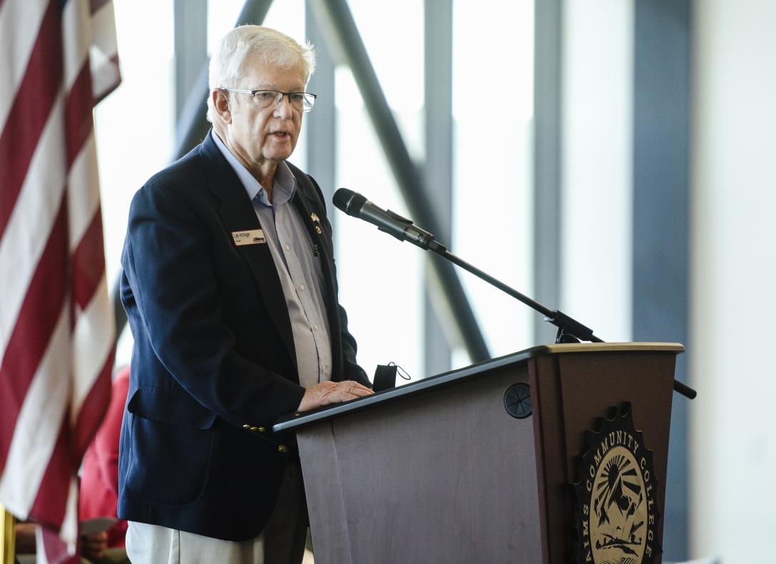 Lyle Achziger at microphone