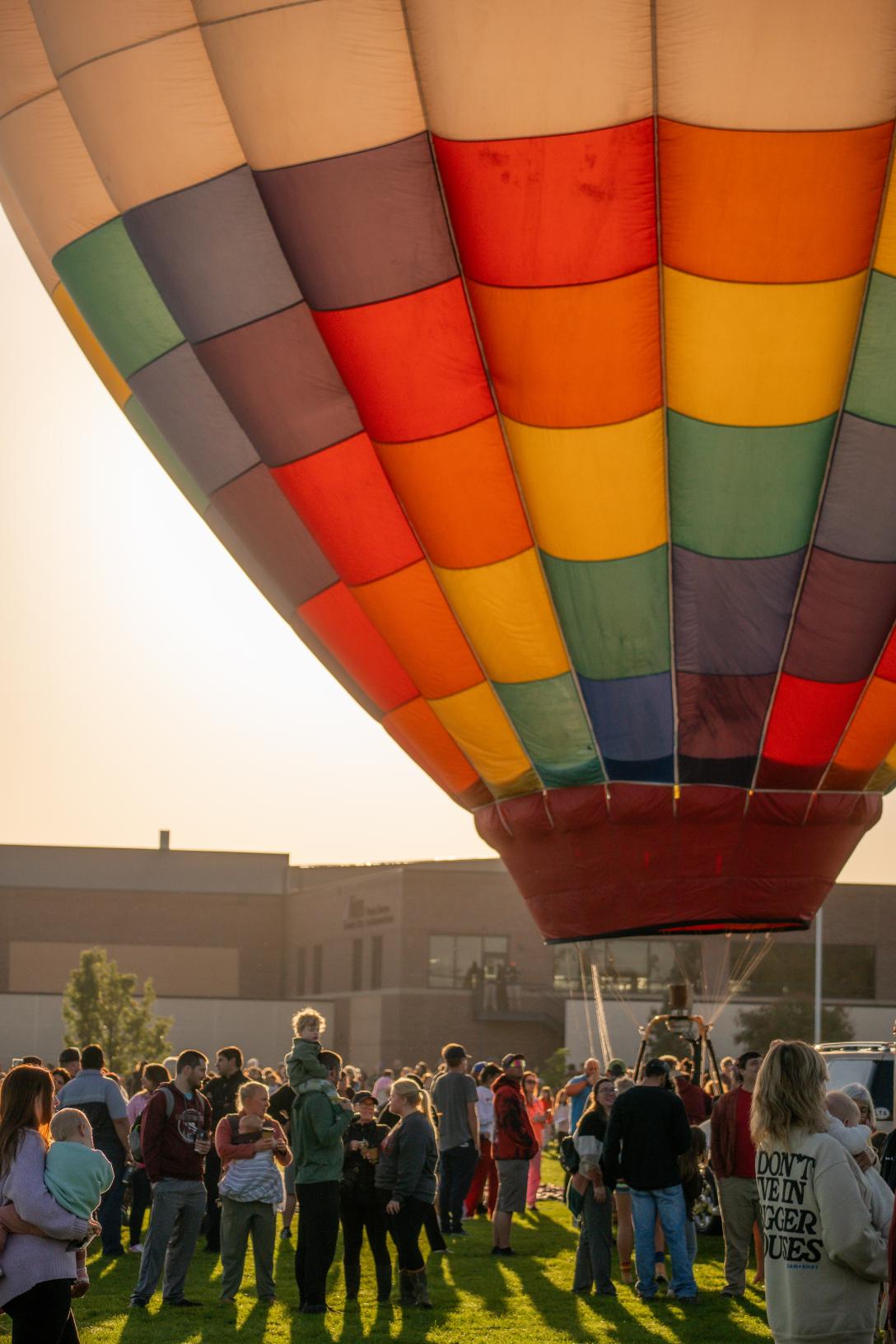 Crowd gathered around hot air balloon