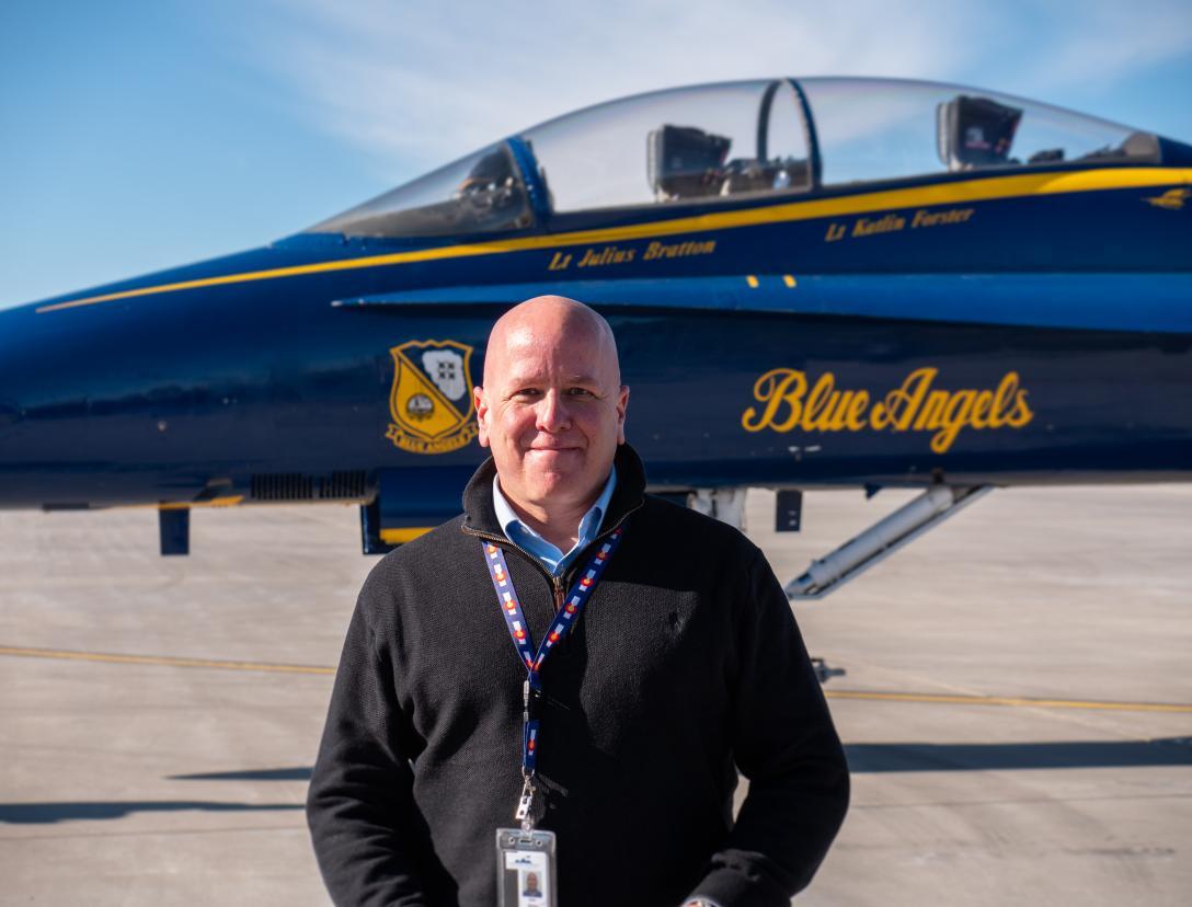 Himler standing in front of a Blue Angle Aircraft