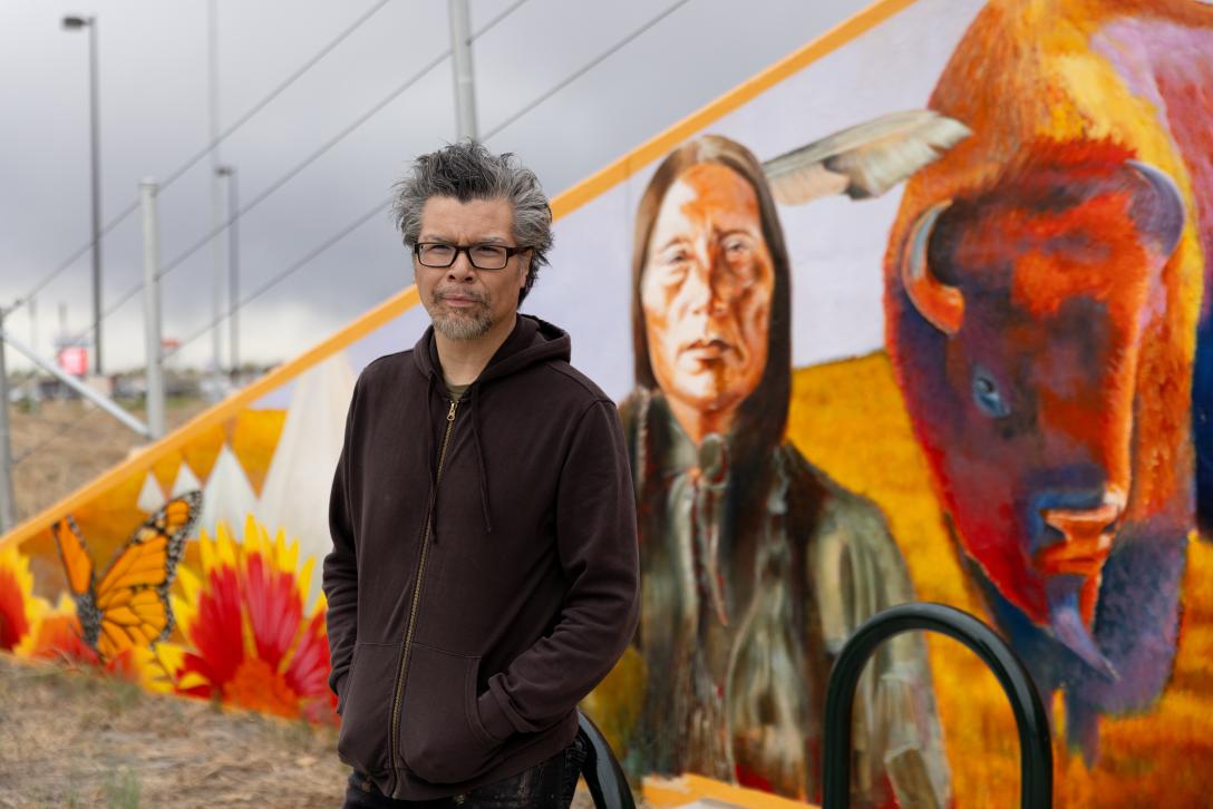 Frank Garza at Connectivity mural
