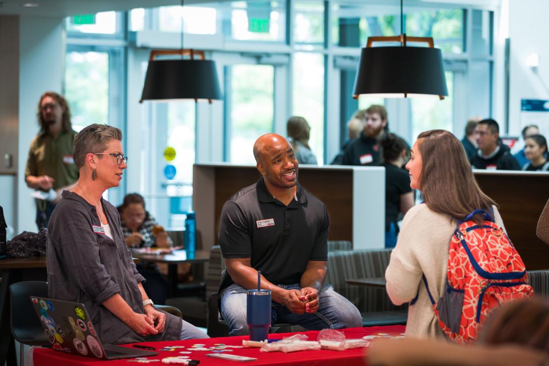people talking at career fair
