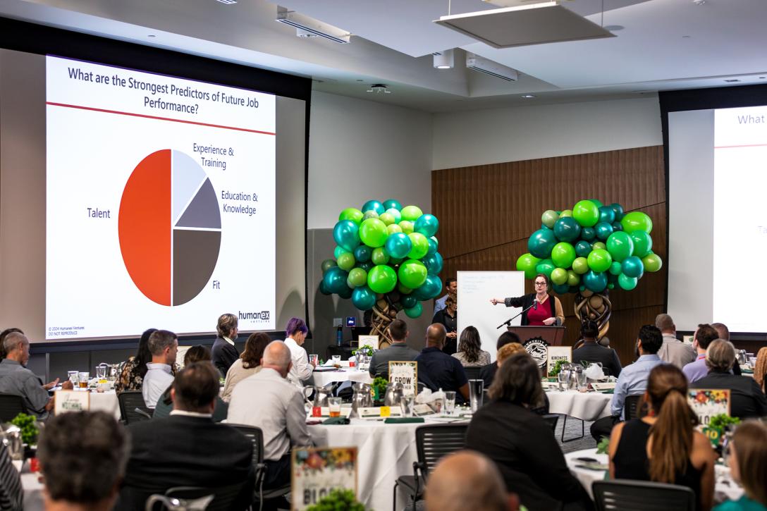 People in a conference setting looking a a presenation