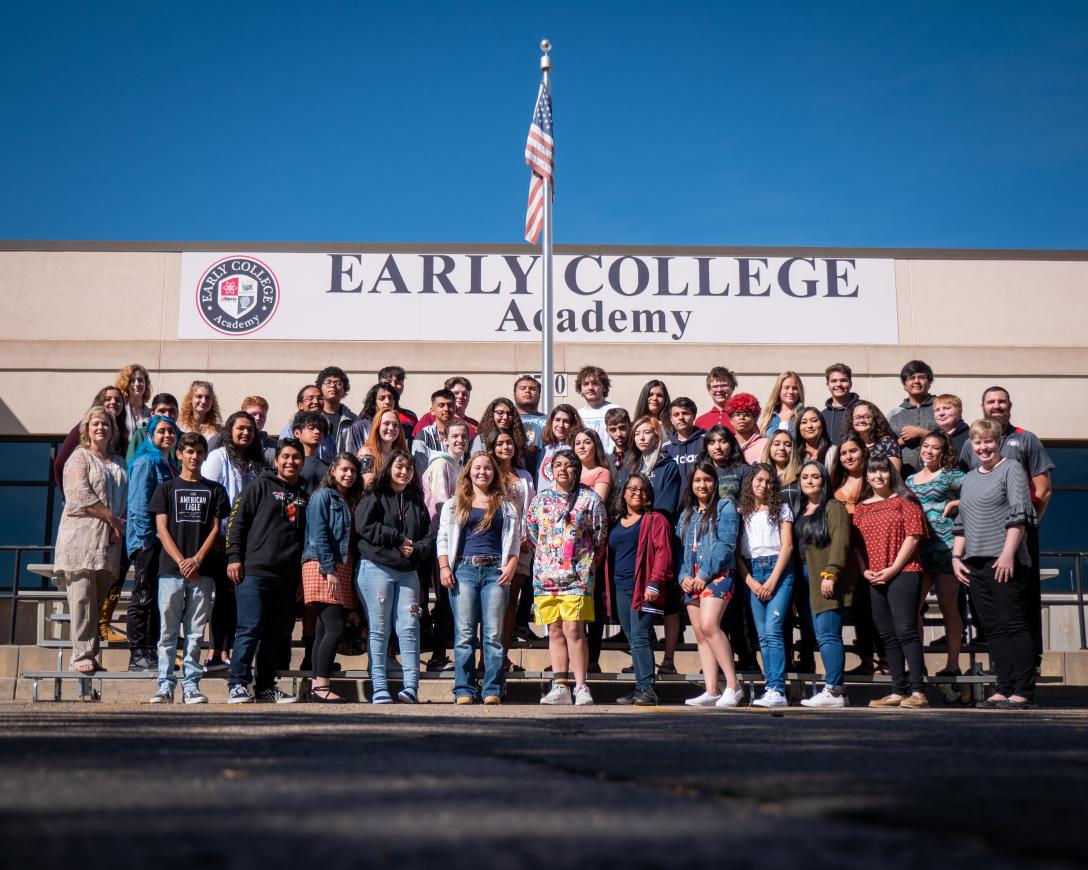 Aims Early College Academy graduates gathered in front of the ECA building. 