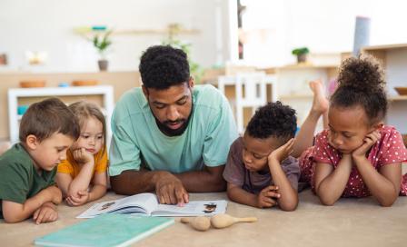 preschool teacher reading to children