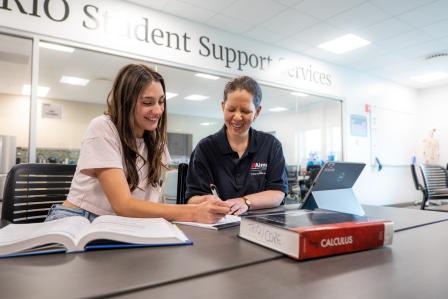 Aims transfer student working with academic advisor